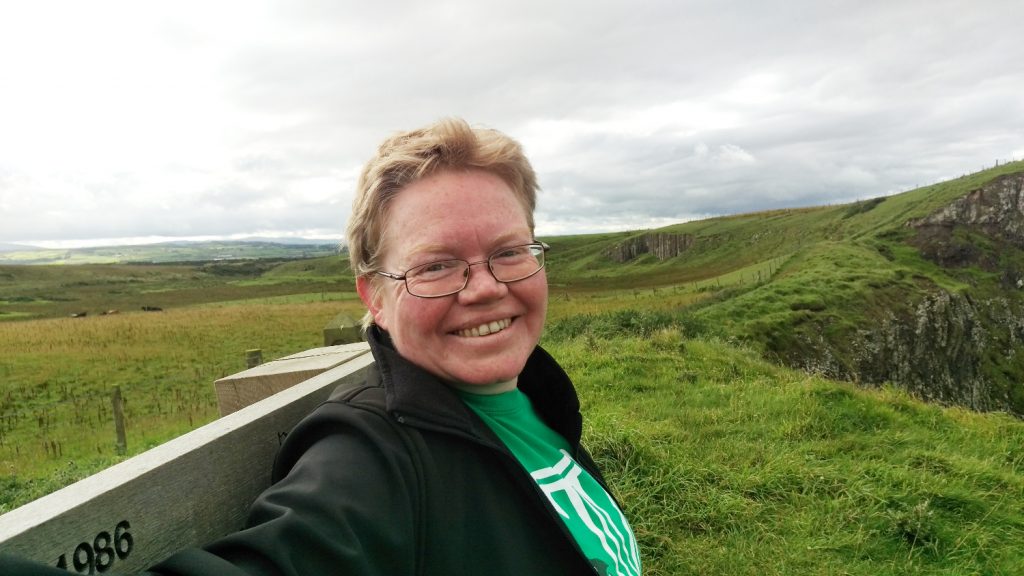 Photo of Fionna relaxing on the bench at Hamilton's Seat